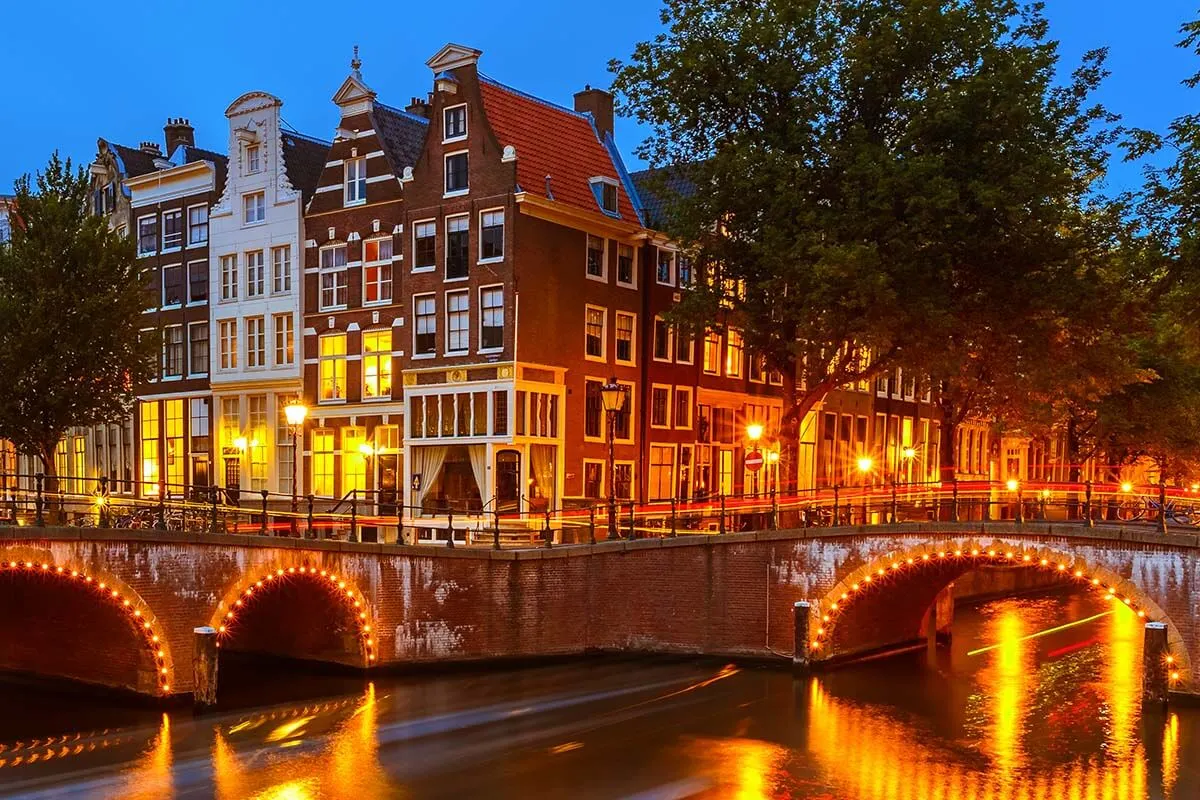Amsterdam canals and bridges lit at night