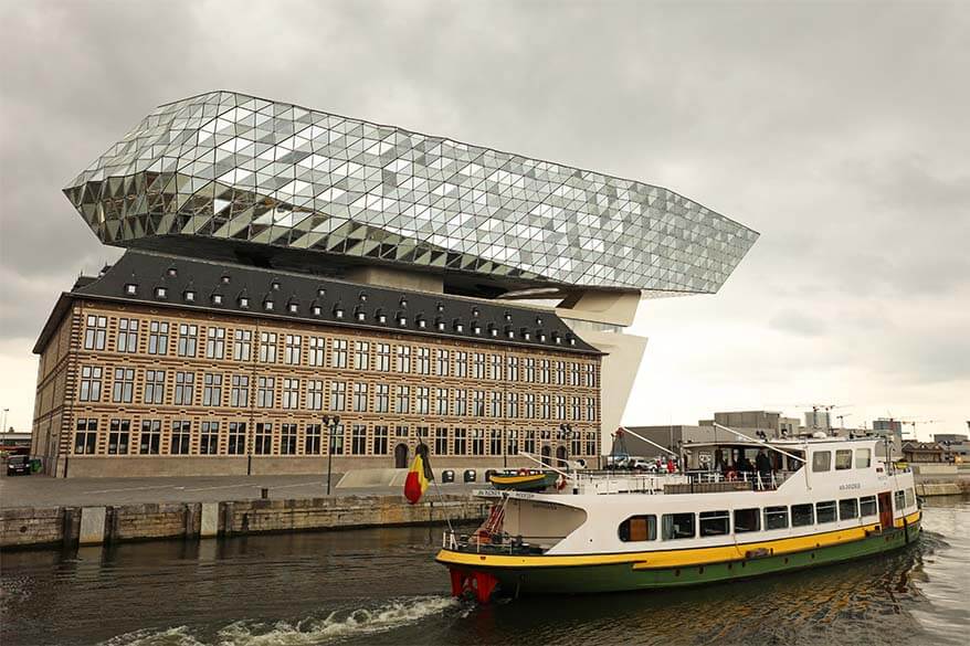 Boat tour in Antwerp harbor passing the Port House