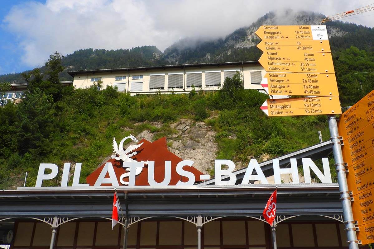 Hiking signs at Pilatus-Bahn railway station in Alpnachstad Switzerland