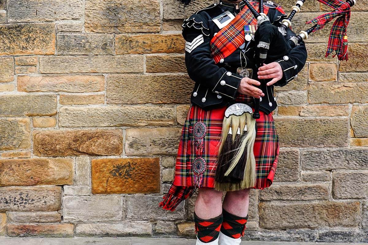 Scottish Bagpiper in a traditional kilt in Edinburgh