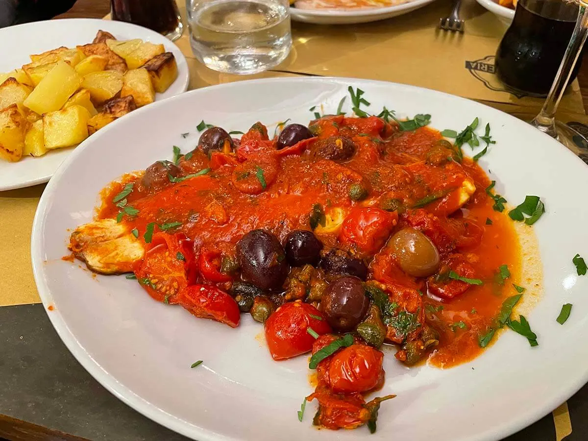 Fish prepared Sicilian way - dinner at a restaurant in Rome