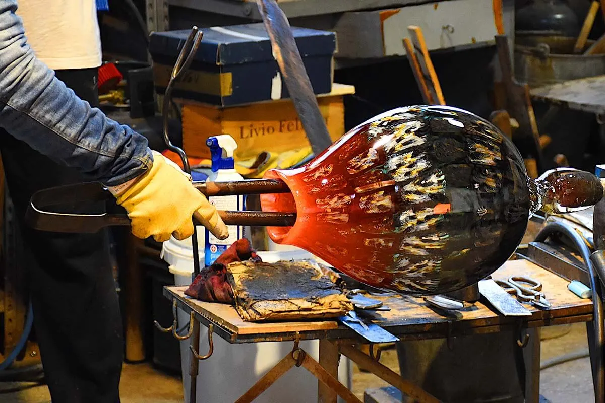 Murano glass blowing demonstration is one of the popular tourist attractions in Venice