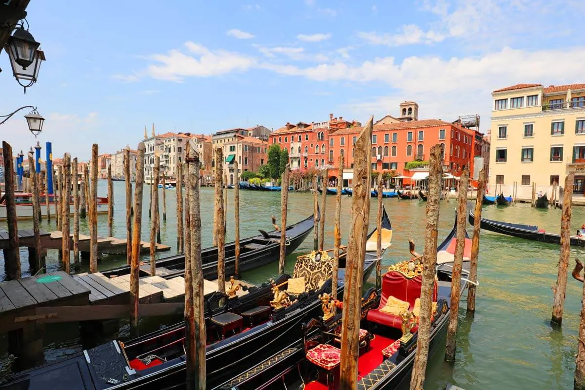 Venetian gondolas on the Grand Canal near Rialto Bridge
