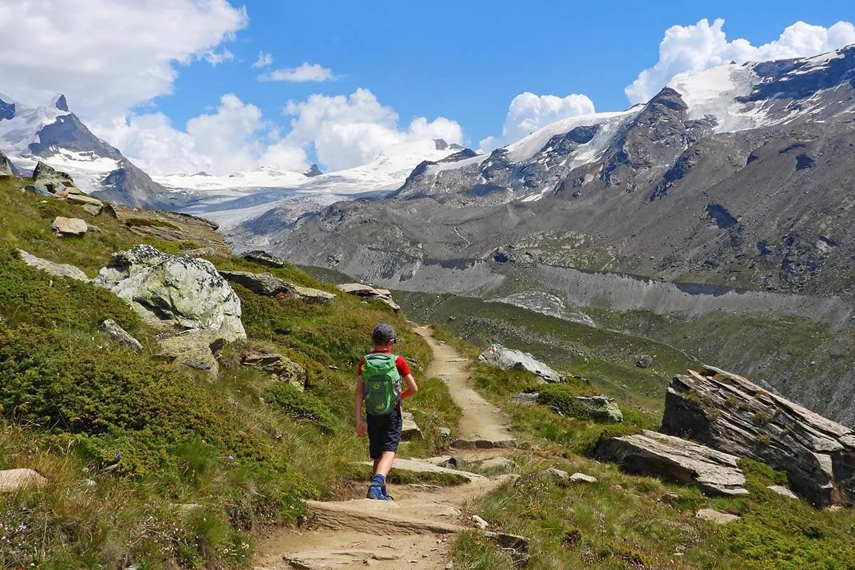 Child hiking the 5 lakes trail in Zermatt