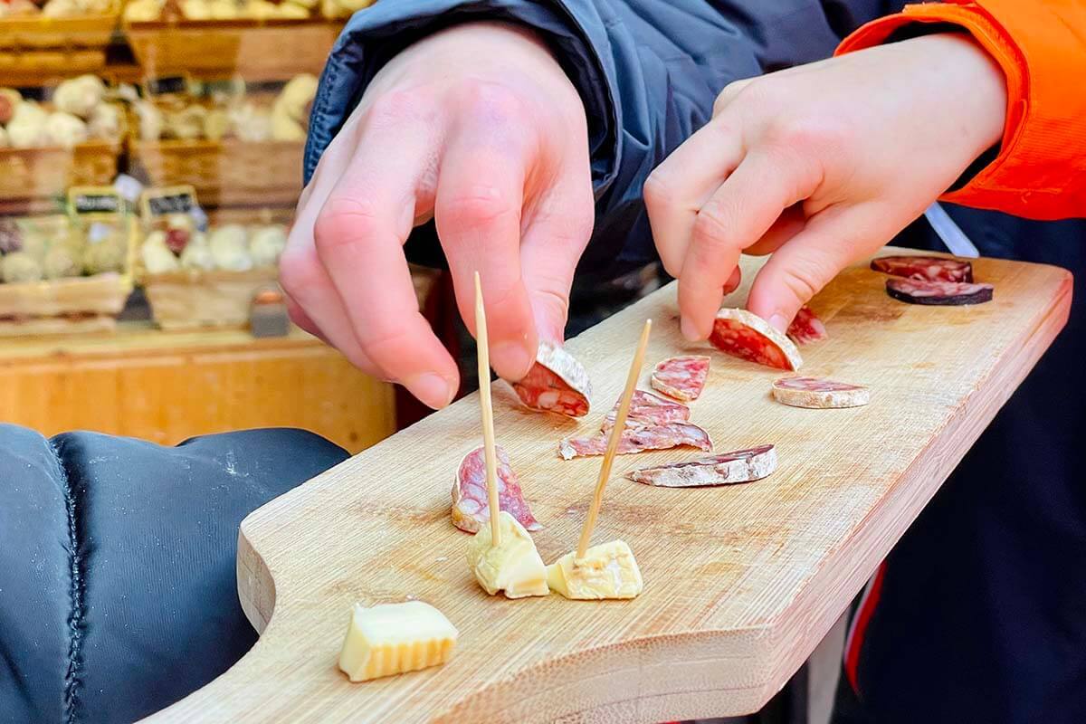 Cheese and smoked sausage tasting at a local store in Eguisheim France