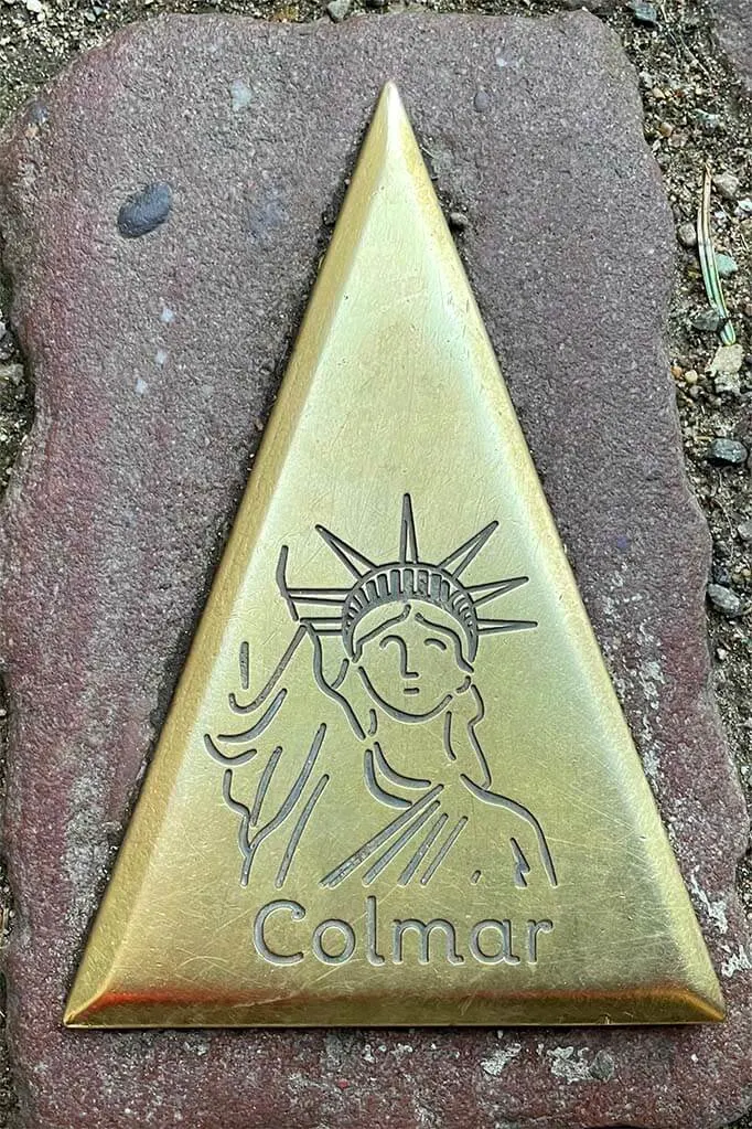 Colmar tourist route signs with the Statue of Liberty