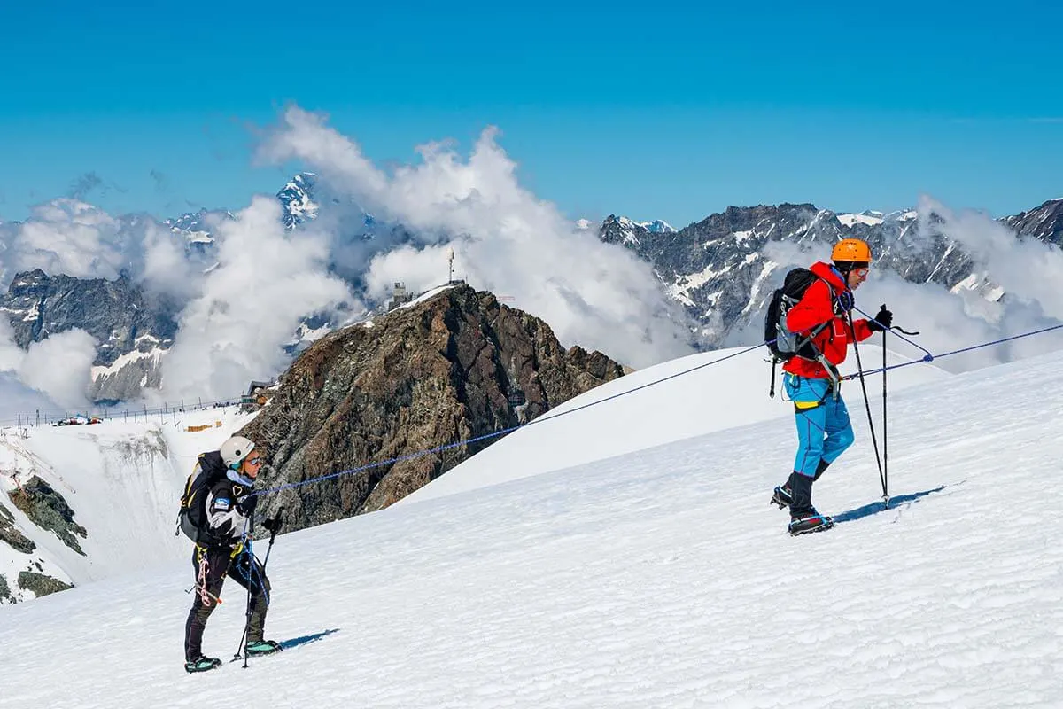 Hikers climbing on the Breithorn Ascent trail in Zermatt