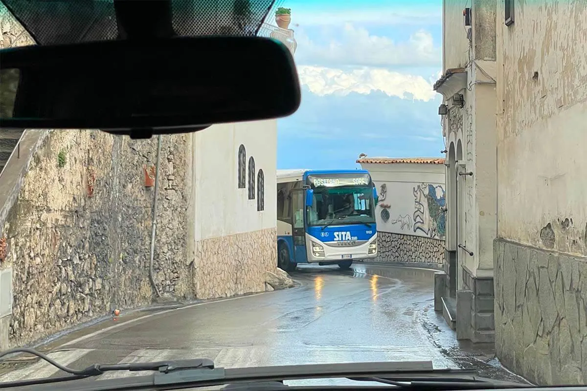Amalfi Coast bus driving on the narrow road near Positano (Italy)