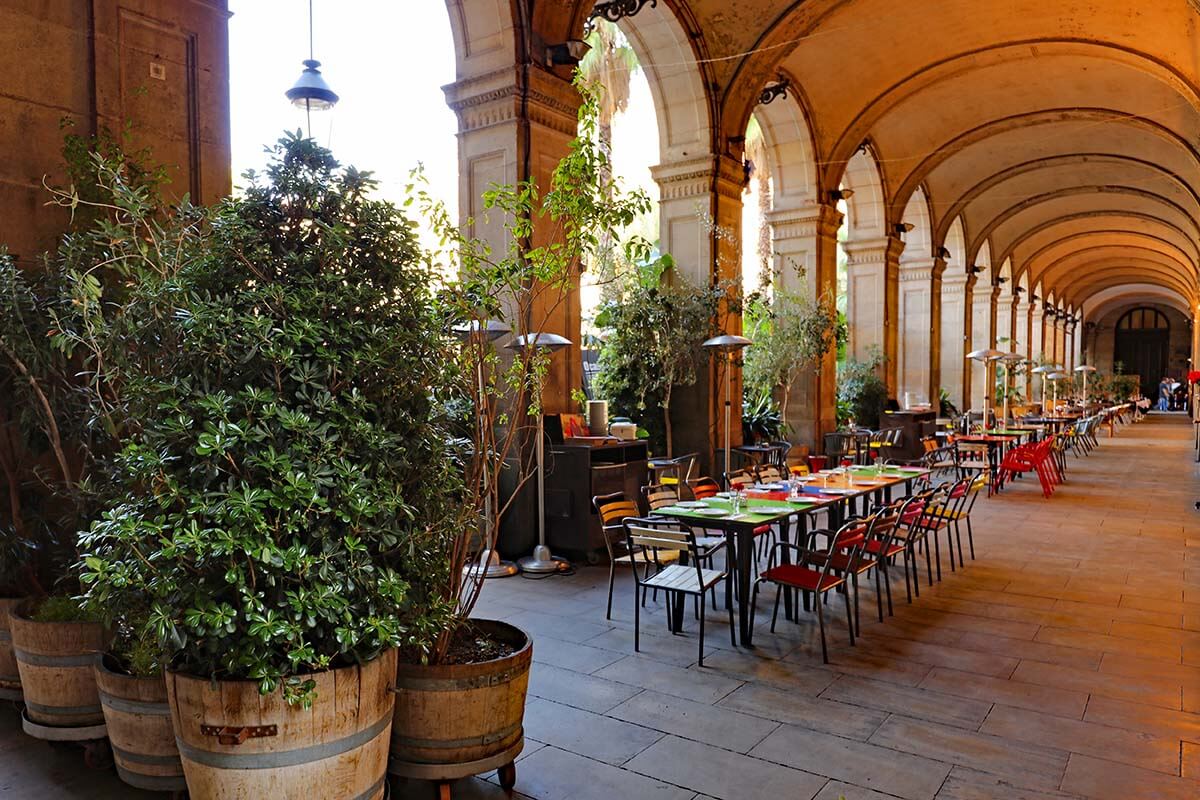 Restaurants at a covered arcade of Plaça Reial in Barcelona