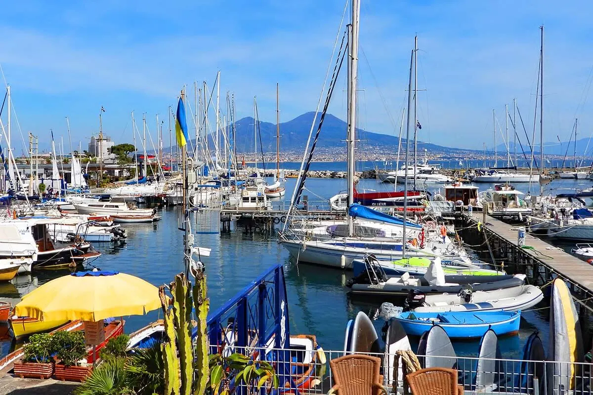 Boats at Naples waterfront with Mt Vesuvius in the background