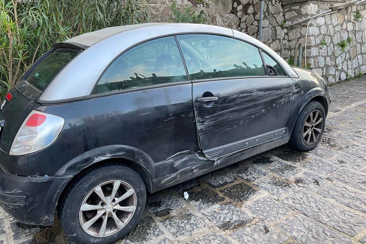 Badly scratched car on the Amalfi Coast in Italy