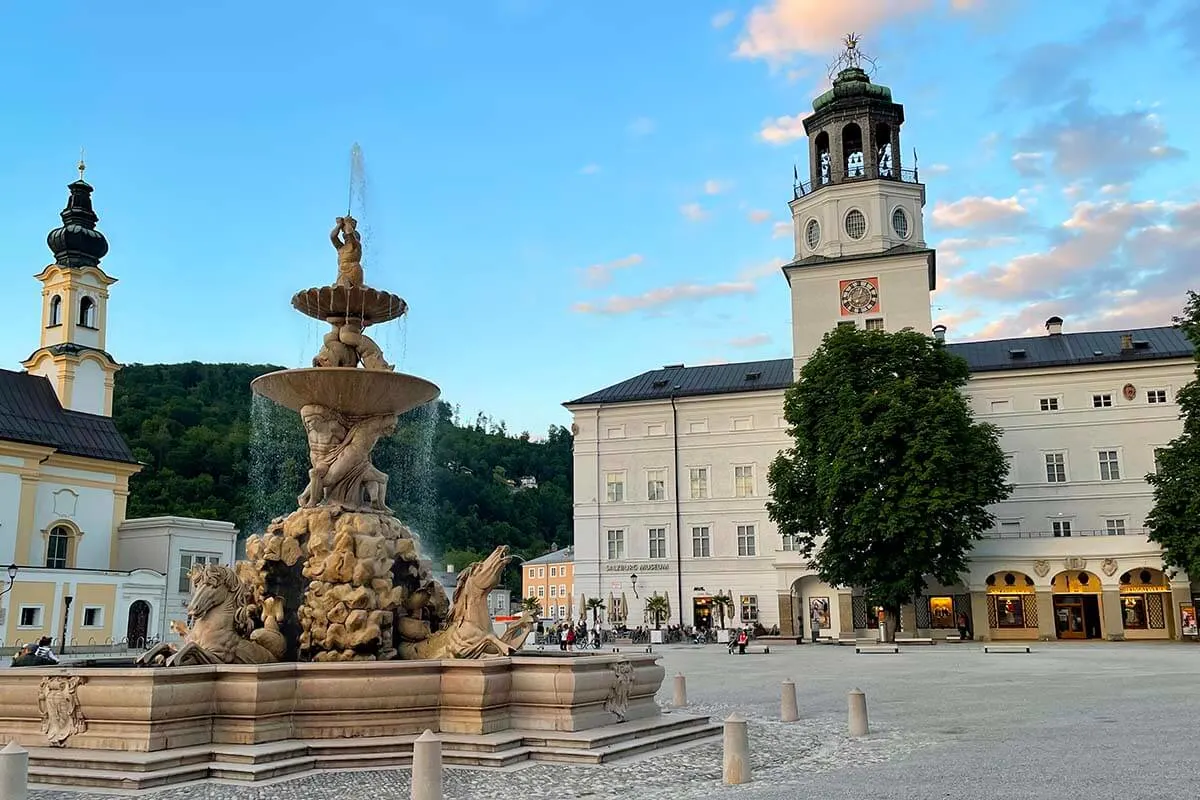 Fountain on Residenzplatz and Salzburg Carillon in the old town of Salzburg Austria
