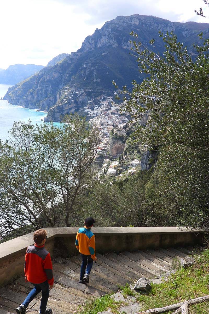 Kids walking on steep staircase between Nocelle and Positano