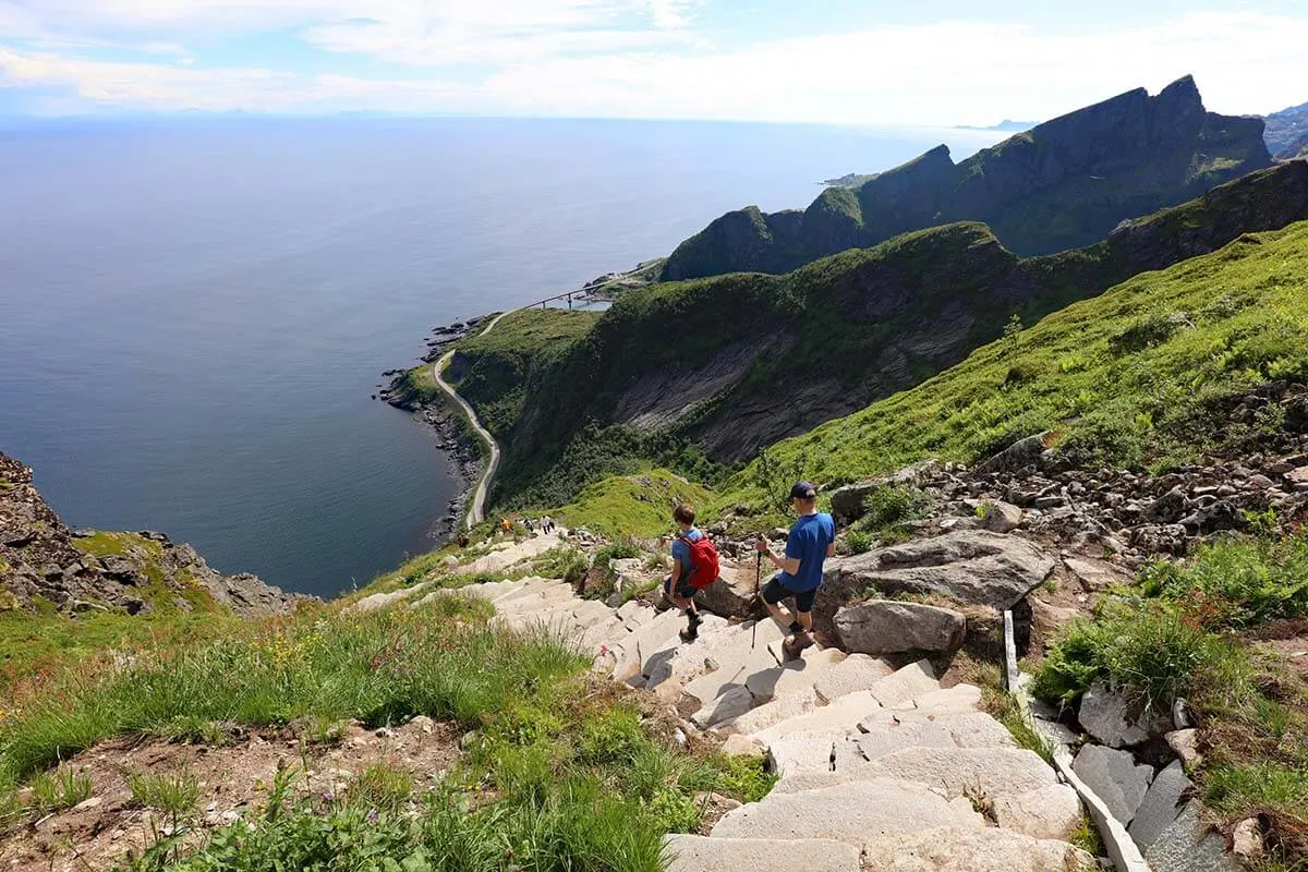 Hiking on steep sherpa stairs in Lofoten Islands in Norway