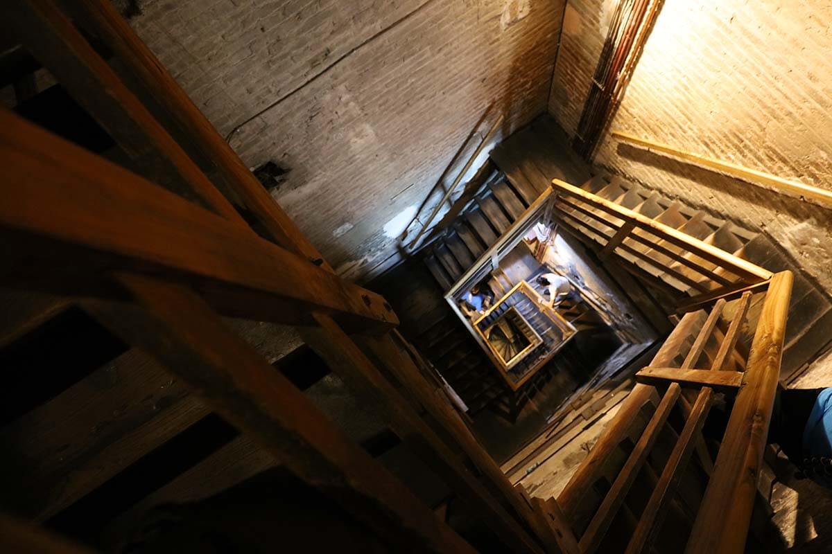 Climbing the wooden staircase of Asinelli Tower in Bologna
