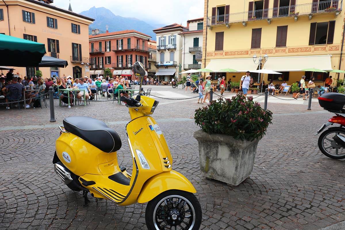 Yellow Vespa in Menaggio town on Como Lake in Italy