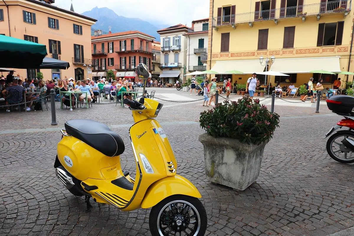 Yellow Vespa in Menaggio town on Como Lake in Italy