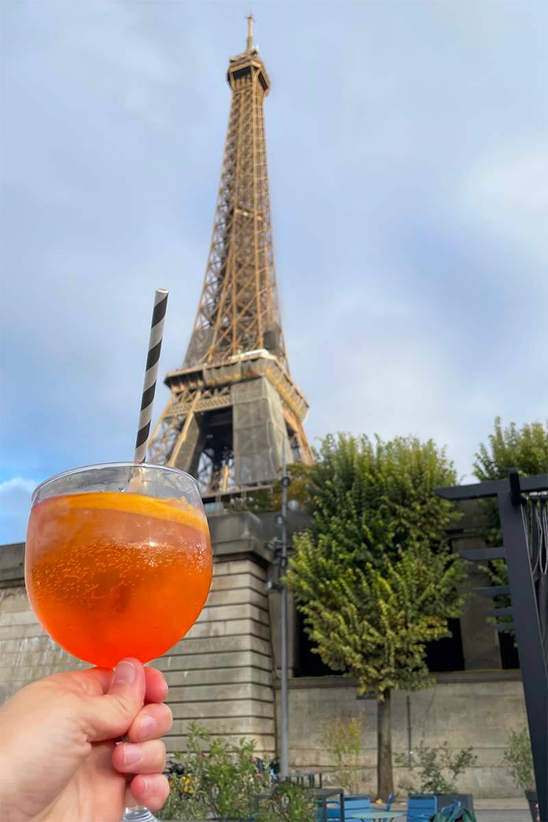 Drinking Aperol Spritz in front of the Eiffel Tower in Paris