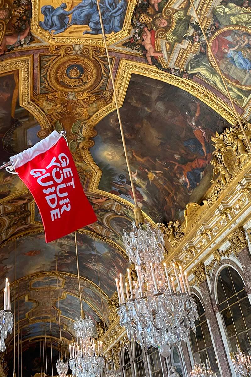 Obtenga su bandera de guía turística en el Palacio de Versalles, París, Francia