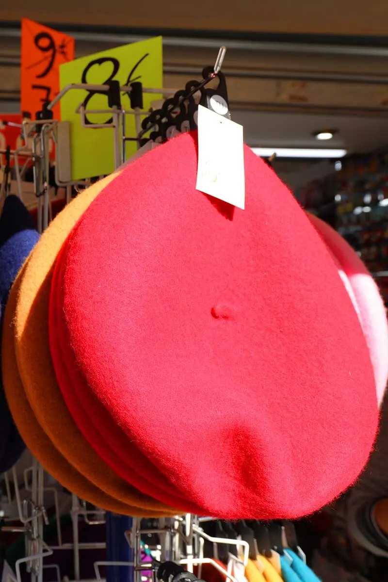 Red beret hat for sale at a souvenir shop in Paris