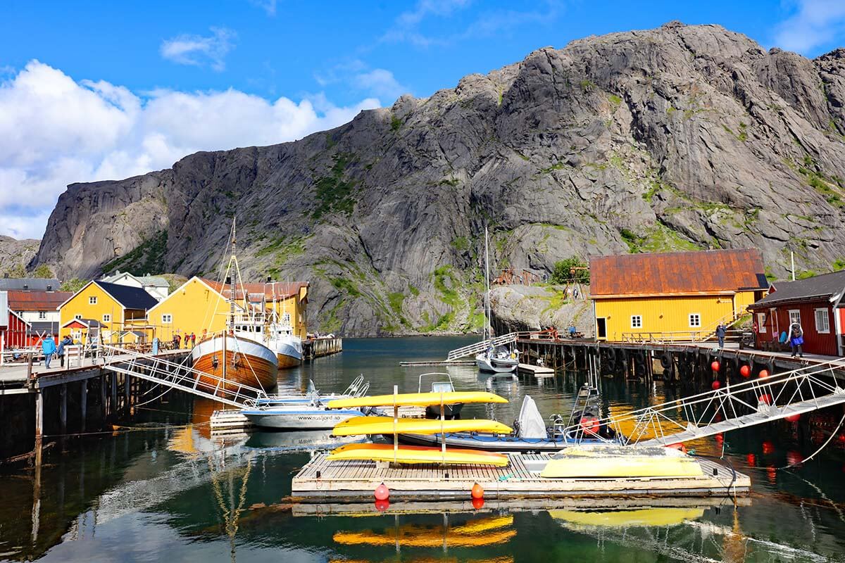 Colorful cabins and kayaks in Nusfjord harbor in Lofoten