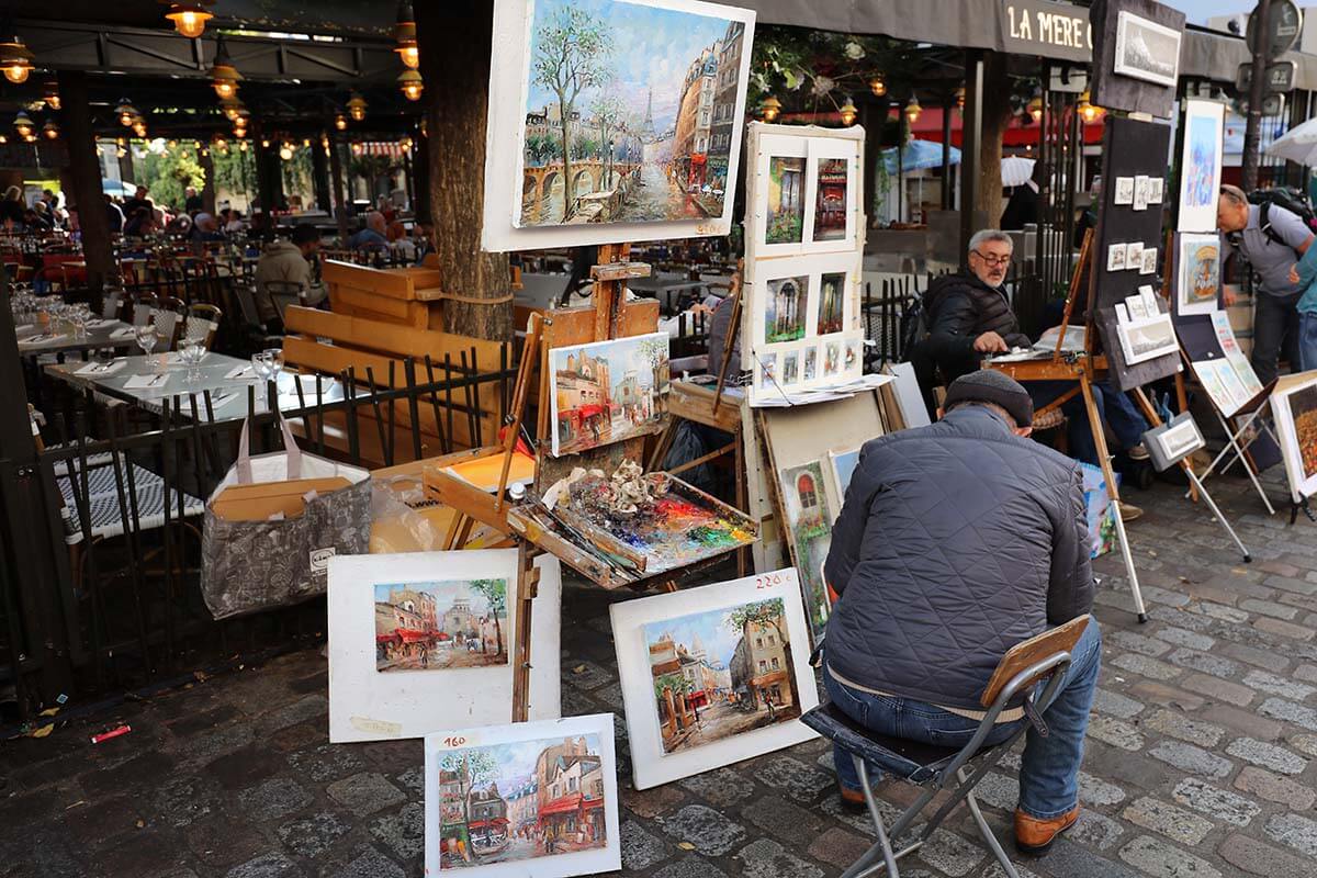 Parisian artists selling paintings on Place du Tertre in Montmartre