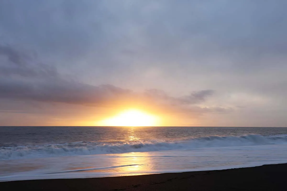 Sunset on Reynisfjara beach in Iceland in winter