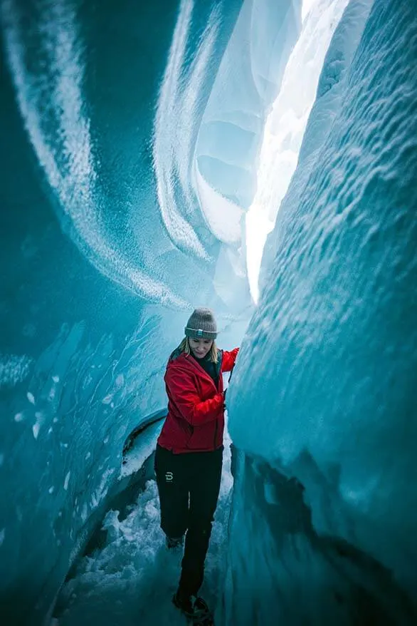 Walking inside a natural ice cave on Langjokull Glacier in Iceland