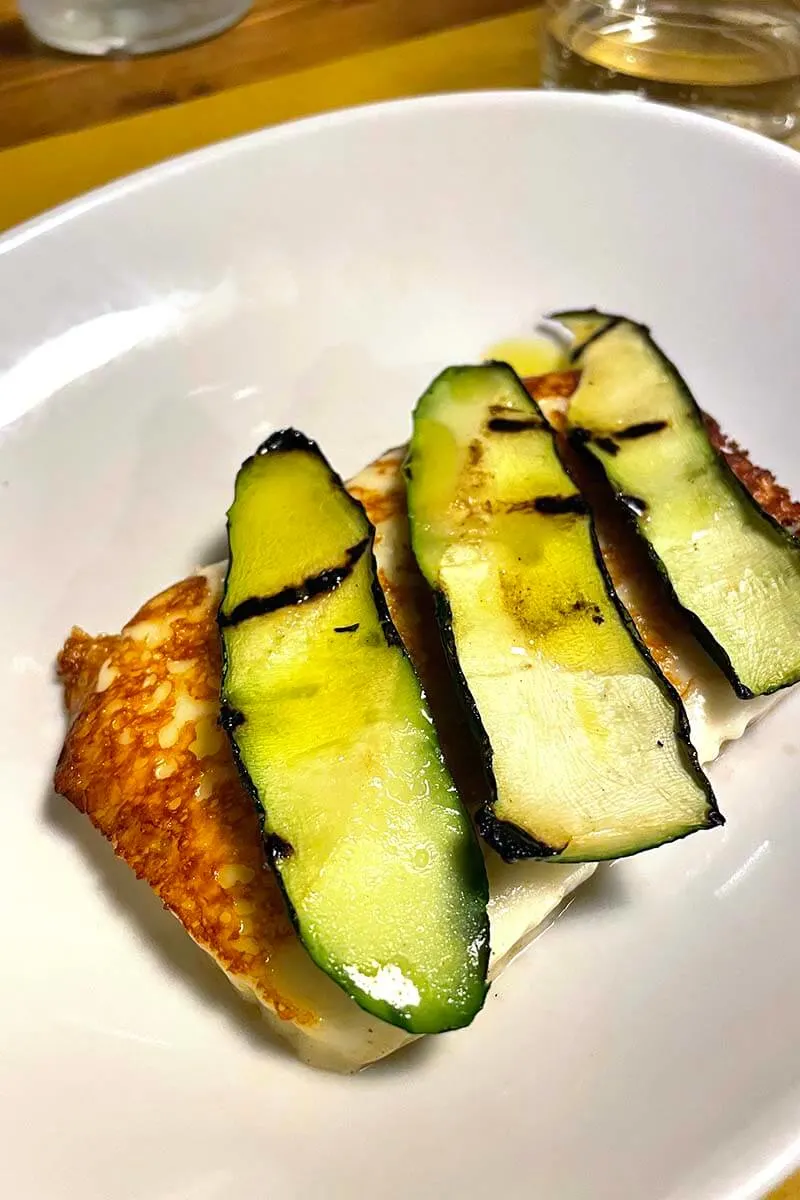 Grilled pecorino cheese and zucchini - local speciality at a restaurant in Tuscany