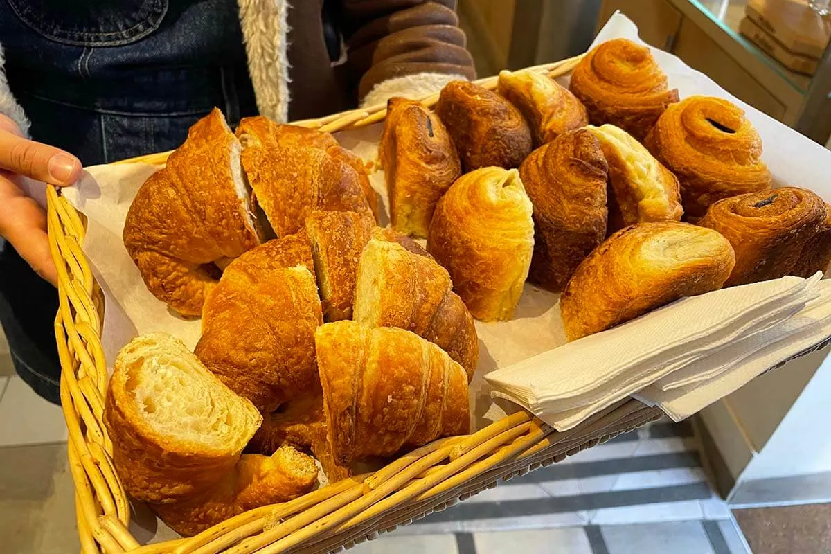 French croissants tasting at a local bakery during a French food tour in Paris