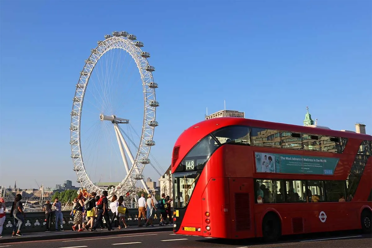 London Eye and red double-decker bus on Westminster Bridge