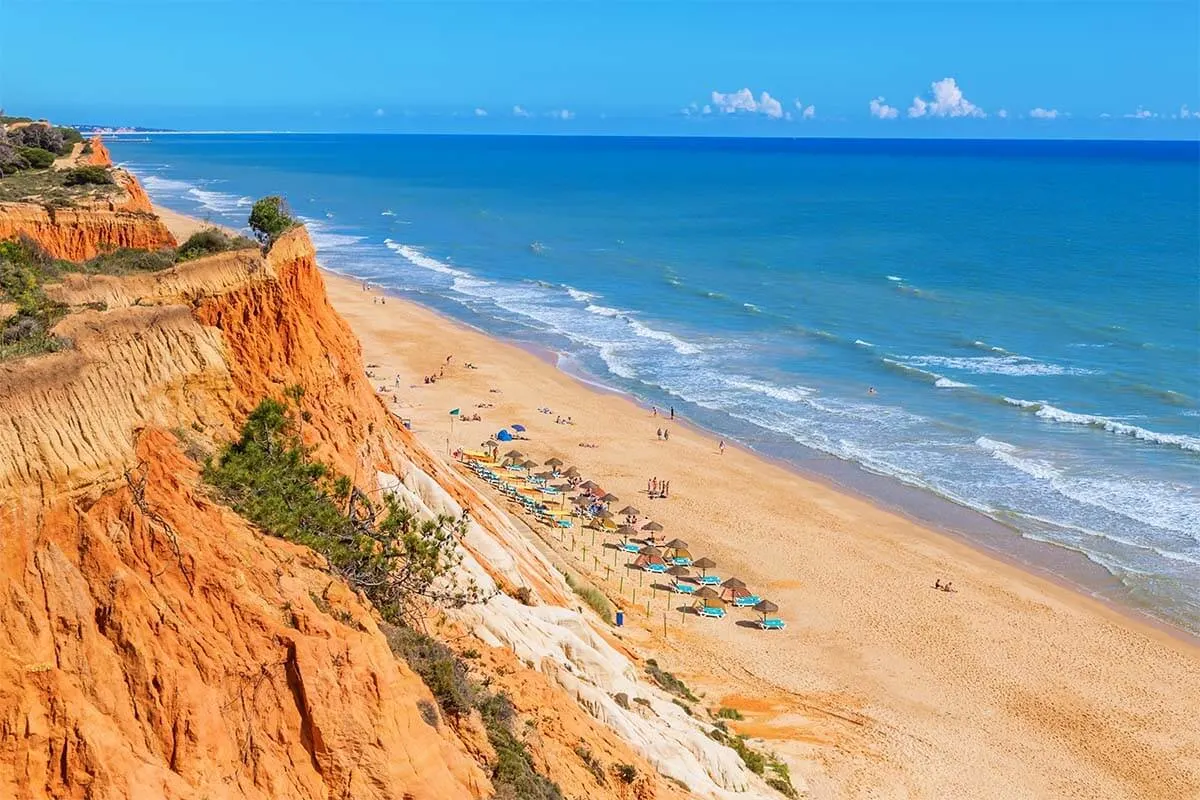 Beach chairs and umbrellas on Falesia Beach in Albufeira