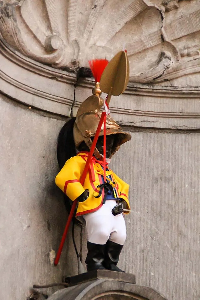 Manneken Pis wearing a costume of a guard