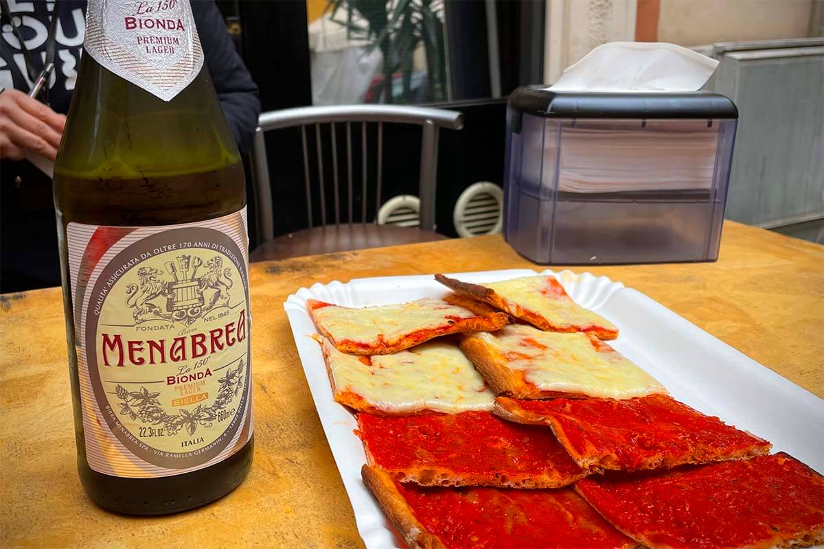 Traditional Rome pizza and Italian beer on a Rome food tour