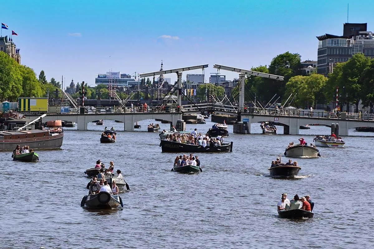 Amstel River in Amsterdam with lots of boats on a weekend