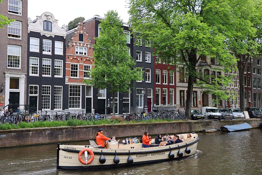 Canal cruise boat on Herengracht in Amsterdam