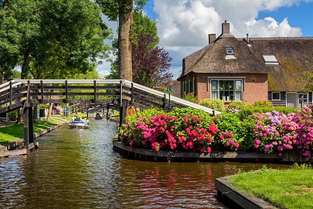 Giethoorn village with canals instead of streets is a popular day trip destination from Amsterdam