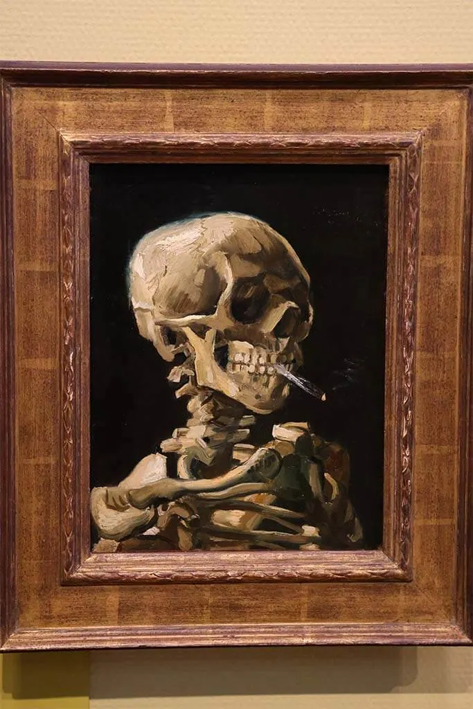 Head of a skeleton with a burning cigarette painting by Vincent Van Gogh in museum in Amsterdam