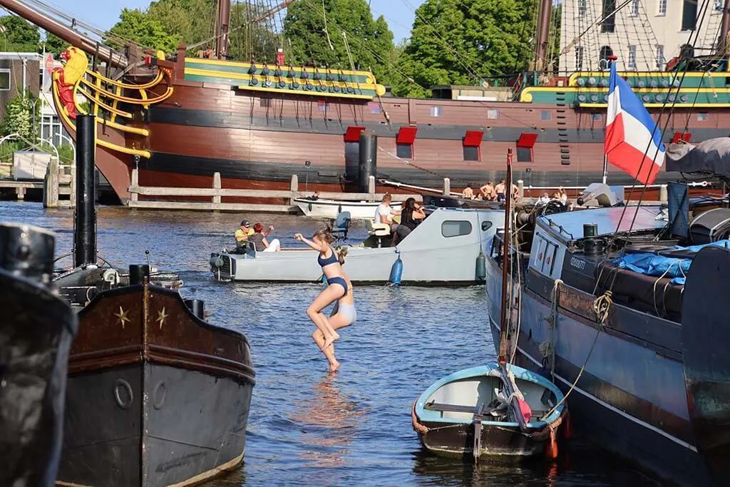 People swimming in Amsterdam canals in June