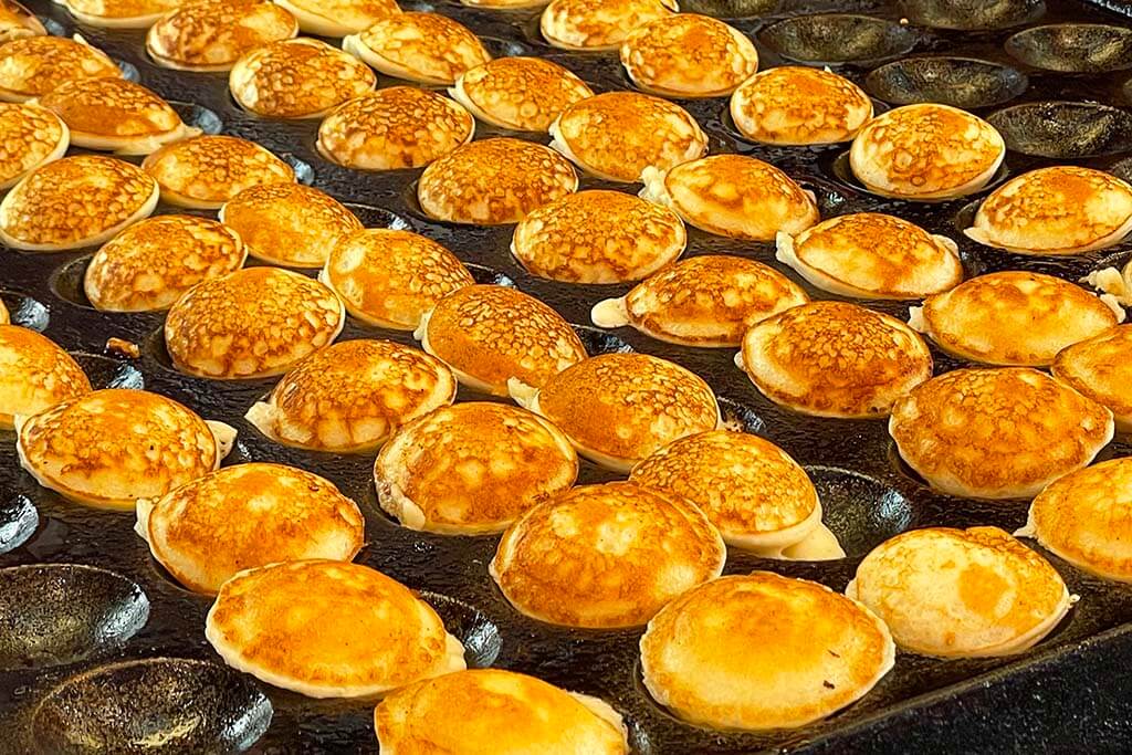 Poffertjes - Dutch mini pancakes at Albert Cuyp Market in Amsterdam