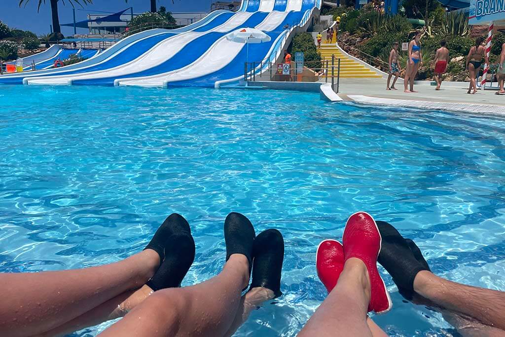 People wearing water shoes at Slide Splash water park in Algarve