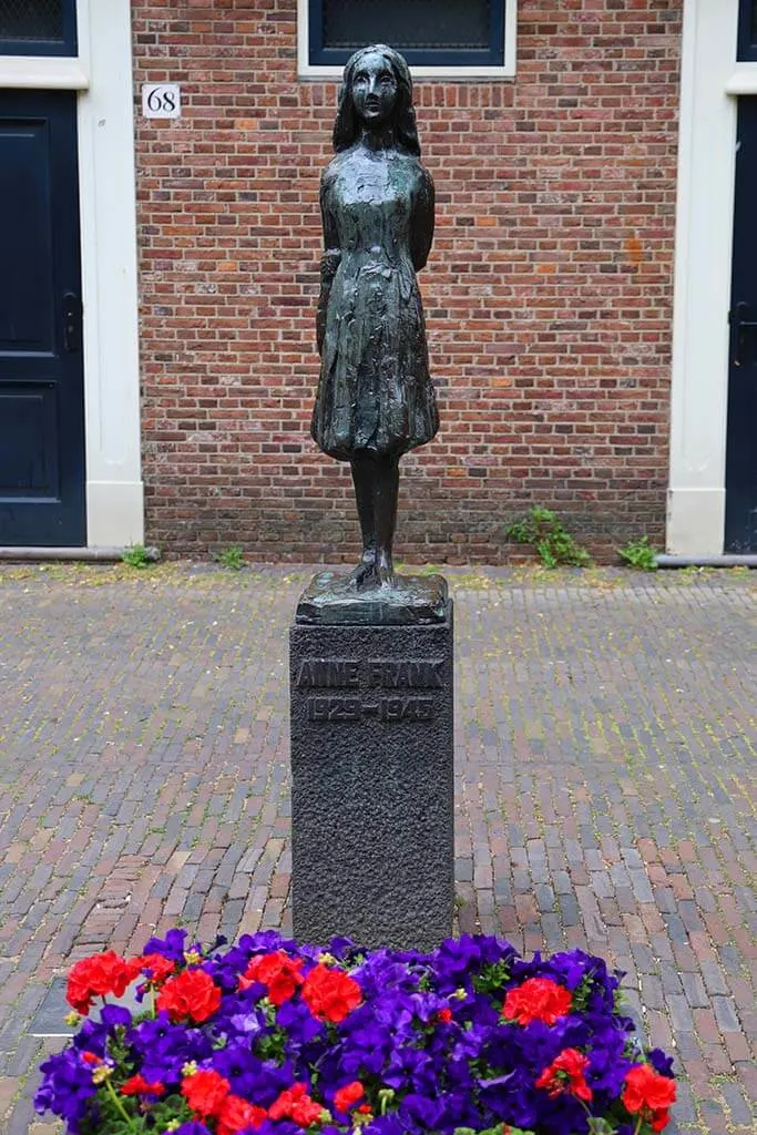 The statue of Anne Frank next to West Church in Amsterdam