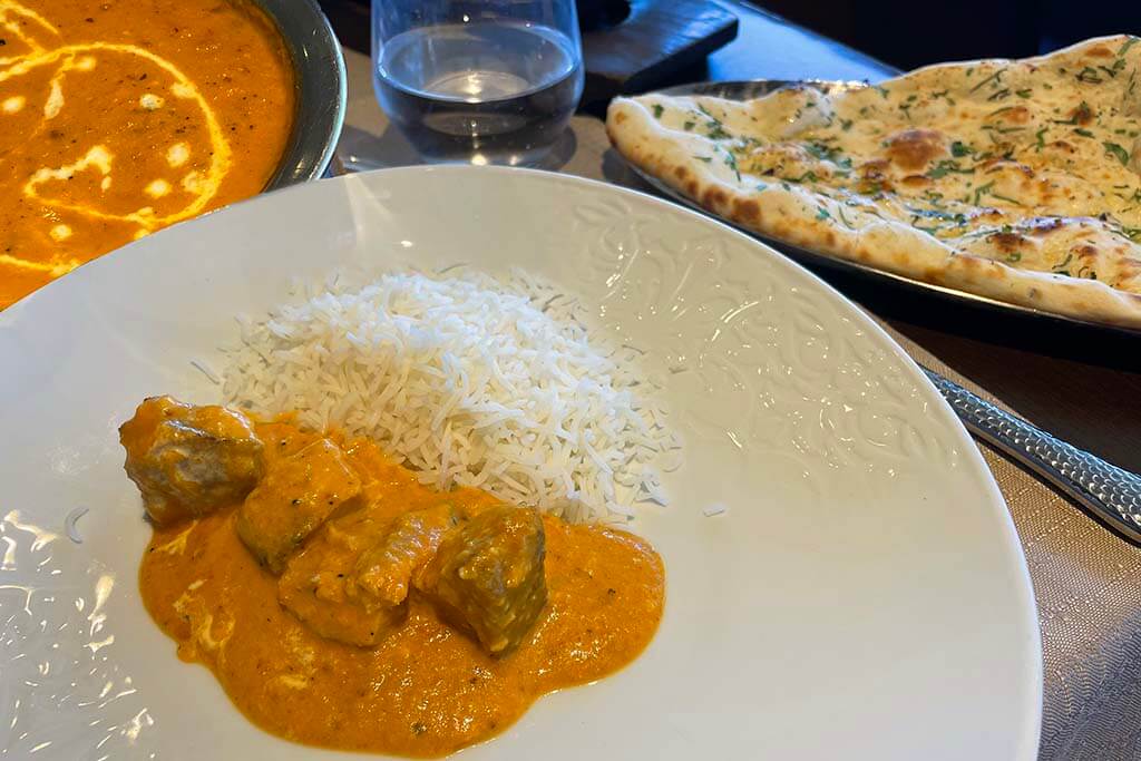Butter chicken and Naan bread at Clay Oven Indian restaurant in Albufeira