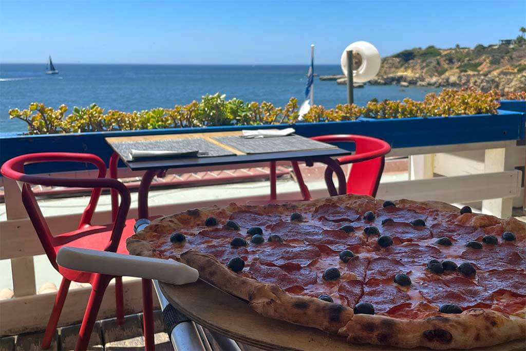 Family pizza at San Martino Restaurant overlooking Oura Beach in Albufeira