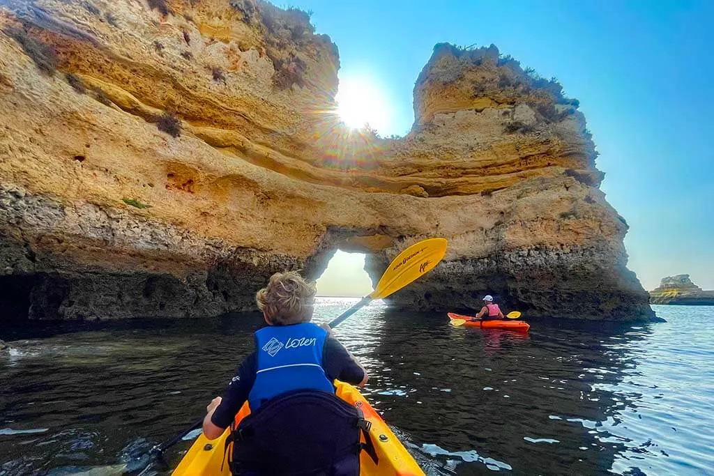 Kayaking under natural arches of Ponta da Piedade in Lagos Portugal