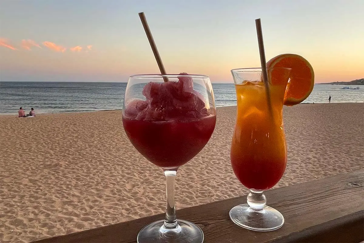 Cocktails at a beach in Algarve at sunset