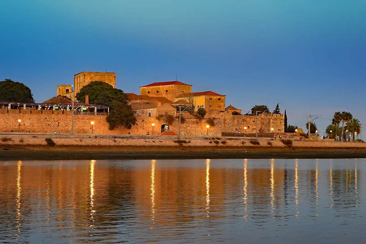 Faro town walls and old beer factory looking like a castle when seen from Ria Formosa lagoon