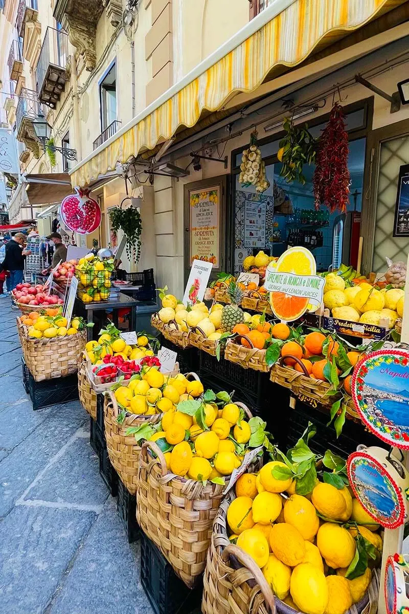 Sorrento street with shops selling lemons and souvenirs (Italy)