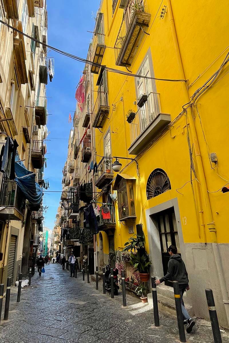 Yellow house and narrow streets of Naples, Italy