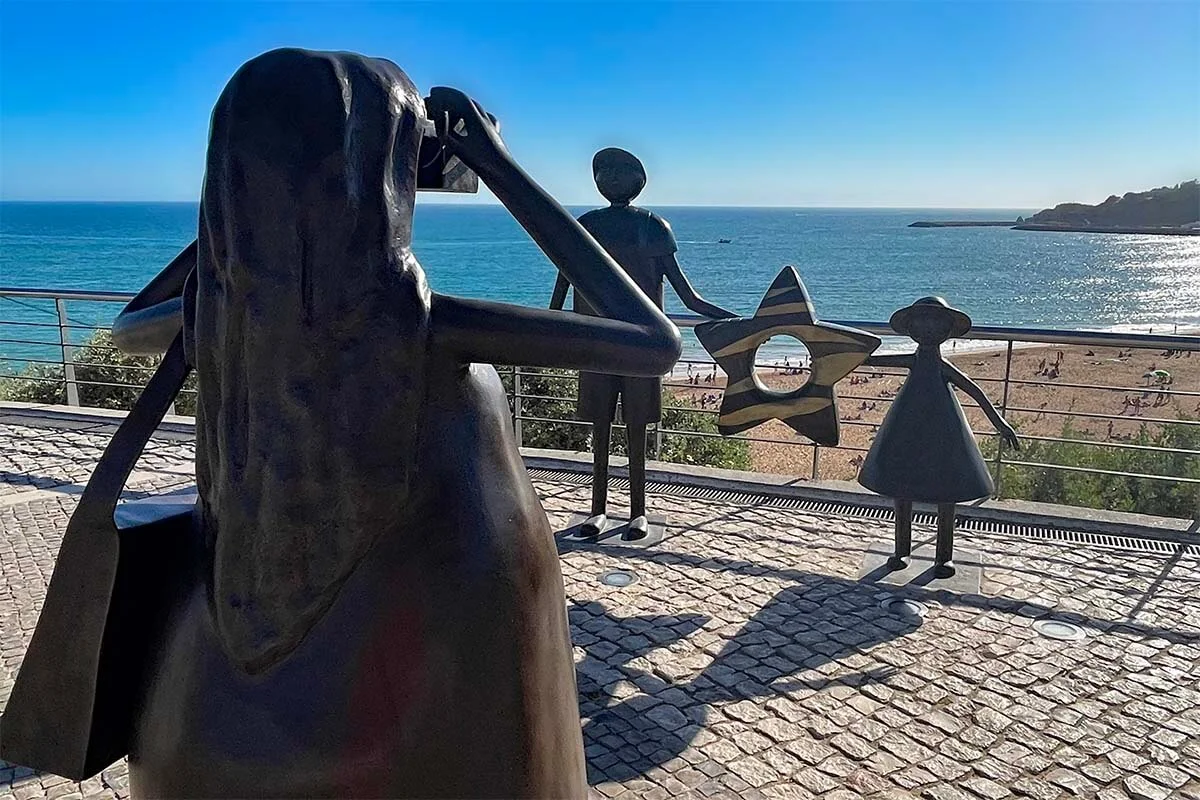 Albufeira sculpture of a mother taking a picture of her kids at the main beach - Algarve Portugal